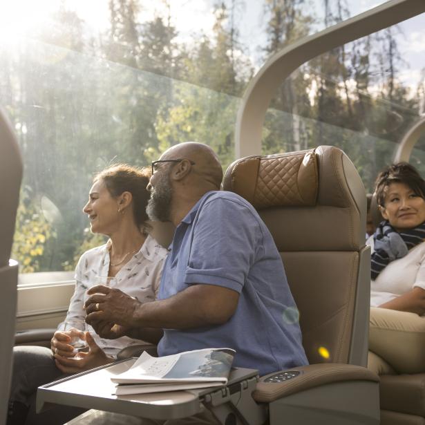 Image of two guests looking out the window from the Rocky Mountaineer